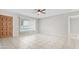 Bright living room with tile floors, ceiling fan, and large window at 6808 N 33Rd Ave, Phoenix, AZ 85017