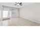 Neutral living area with a light-filled window and tile floor at 6808 N 33Rd Ave, Phoenix, AZ 85017