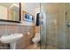 Stylish bathroom featuring a modern vanity and glass-enclosed shower at 7334 N 7Th Ave, Phoenix, AZ 85021