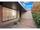 Inviting front entrance with decorative stones, cacti, a brick walkway, and a large window at 7334 N 7Th Ave, Phoenix, AZ 85021