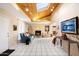 Bright living room with skylight, fireplace, tile flooring, and contemporary furnishings at 7334 N 7Th Ave, Phoenix, AZ 85021