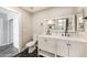 Bathroom featuring a modern dual sink vanity with a marble countertop, and geometric patterned floors at 7559 W Turquoise Ave, Peoria, AZ 85345