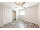 This bedroom features hard surface floors, neutral paint, and natural light from a window at 7559 W Turquoise Ave, Peoria, AZ 85345