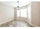 Dining area featuring modern lighting and bright windows at 7559 W Turquoise Ave, Peoria, AZ 85345