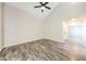 Inviting living room featuring wood-look floors and neutral wall color at 7559 W Turquoise Ave, Peoria, AZ 85345