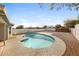 This backyard features a private pool with a surrounding concrete patio and low maintenance gravel landscaping at 7559 W Turquoise Ave, Peoria, AZ 85345