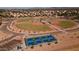 Aerial view featuring baseball field and modern pickleball courts within a vibrant community at 7635 E Pampa Ave, Mesa, AZ 85212