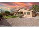 Backyard with rock, grass, and covered patio at 7635 E Pampa Ave, Mesa, AZ 85212