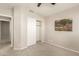 Bedroom featuring neutral carpet, closet, ceiling fan, and a painting hanging on the wall at 7635 E Pampa Ave, Mesa, AZ 85212