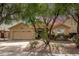 Beautifully landscaped front yard with a well-maintained single-story home featuring a two-car garage at 7635 E Pampa Ave, Mesa, AZ 85212