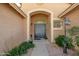 Inviting entryway showcasing a double door entrance and desert landscaping at 7635 E Pampa Ave, Mesa, AZ 85212