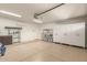 Garage features an epoxy floor, storage cabinets, and an air conditioner at 7635 E Pampa Ave, Mesa, AZ 85212