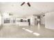 Bright, open-concept living room showcasing neutral colors and a tiled floor at 7635 E Pampa Ave, Mesa, AZ 85212