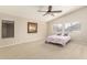 Relaxing bedroom with a vaulted ceiling, neutral paint, and large windows at 7635 E Pampa Ave, Mesa, AZ 85212