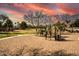 Community playground featuring well-maintained equipment, set under a vibrant sunset sky at 7635 E Pampa Ave, Mesa, AZ 85212