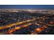 Night aerial view of the neighborhood showcasing the home's location, street layout, and illuminated surroundings at 8567 N 107Th Dr, Peoria, AZ 85345