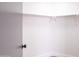 Empty closet boasts storage shelves and a clothes rod at 8567 N 107Th Dr, Peoria, AZ 85345