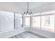 Dining area featuring modern lighting and view to backyard at 8567 N 107Th Dr, Peoria, AZ 85345