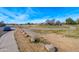 Scenic view of the community golf course with manicured greens, mature trees, and winding pathways at 8567 N 107Th Dr, Peoria, AZ 85345