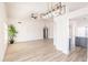 Living room boasting modern chandelier, neutral tones, and stylish flooring at 8567 N 107Th Dr, Peoria, AZ 85345