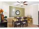 Cozy dining area featuring a ceiling fan, modern table set and stylish decor at 860 E Cierra Cir, San Tan Valley, AZ 85143