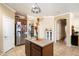 Well-lit kitchen with a center island, granite countertops, and stainless steel appliances at 860 E Cierra Cir, San Tan Valley, AZ 85143