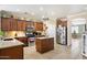 Bright kitchen with stainless appliances, a center island, and ample cabinet storage at 860 E Cierra Cir, San Tan Valley, AZ 85143