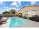 Refreshing backyard pool with a fence for safety and mature landscaping at 860 E Cierra Cir, San Tan Valley, AZ 85143