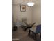 Dining area featuring a glass table and neutral-toned chairs, illuminated by a modern light fixture at 8649 E Royal Palm Rd # 213, Scottsdale, AZ 85258