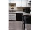 Functional kitchen with ample counter space, a double sink, and black appliances at 8649 E Royal Palm Rd # 213, Scottsdale, AZ 85258