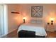 Comfortable bedroom features a cozy bed, soft lighting, and stylish décor at 8649 E Royal Palm Rd # 213, Scottsdale, AZ 85258
