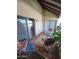 Enjoy outdoor living with a covered patio, seating, and sliding glass doors at 8649 E Royal Palm Rd # 213, Scottsdale, AZ 85258