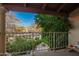 Balcony featuring a serene view of the grounds, with landscaping and mature trees at 1017 E Maryland Ave # 110, Phoenix, AZ 85014