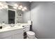 This well lit bathroom features a sink and storage for essentials at 1017 E Maryland Ave # 110, Phoenix, AZ 85014