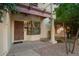 Quaint condo entrance featuring a wooden pergola, desert landscaping, and walkway for easy access at 1017 E Maryland Ave # 110, Phoenix, AZ 85014