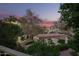 Serene exterior view of community featuring mature trees, landscaping and covered walkways at 1017 E Maryland Ave # 110, Phoenix, AZ 85014