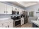 Well lit kitchen features stainless steel appliances and white cabinets at 1017 E Maryland Ave # 110, Phoenix, AZ 85014