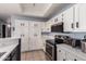 Spacious kitchen features stainless steel oven, microwave and plenty of cabinet space at 1017 E Maryland Ave # 110, Phoenix, AZ 85014