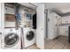 Laundry room featuring tile floors, cabinetry, washer and dryer at 1017 E Maryland Ave # 110, Phoenix, AZ 85014