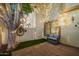Private patio featuring seating, turf, and a shady mature tree at 1017 E Maryland Ave # 110, Phoenix, AZ 85014