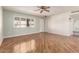 Spacious living room with laminate floors, bright light, and natural light at 10329 W Floriade Dr, Sun City, AZ 85351