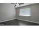 This bedroom features a ceiling fan and gray walls at 10562 W Campana Dr, Sun City, AZ 85351