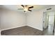 This bedroom features a ceiling fan and gray walls at 10562 W Campana Dr, Sun City, AZ 85351