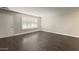 Inviting room with shuttered window and modern flooring at 10562 W Campana Dr, Sun City, AZ 85351