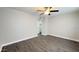 This bedroom features gray walls and wood-look floors at 10562 W Campana Dr, Sun City, AZ 85351
