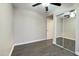 This bedroom features a ceiling fan and mirrored closet at 10562 W Campana Dr, Sun City, AZ 85351