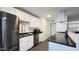 Modern kitchen featuring stainless steel appliances and sleek dark countertops at 10562 W Campana Dr, Sun City, AZ 85351