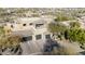 An aerial view of the home featuring a private rooftop patio and three-car garage at 10638 E Hedgehog Pl, Scottsdale, AZ 85262