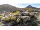 Aerial view of a custom home nestled in the desert with multi-level design and scenic mountain views at 10638 E Hedgehog Pl, Scottsdale, AZ 85262