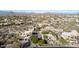 Expansive aerial view of a desert community with custom homes nestled amongst natural rock formations and desert vegetation at 10638 E Hedgehog Pl, Scottsdale, AZ 85262